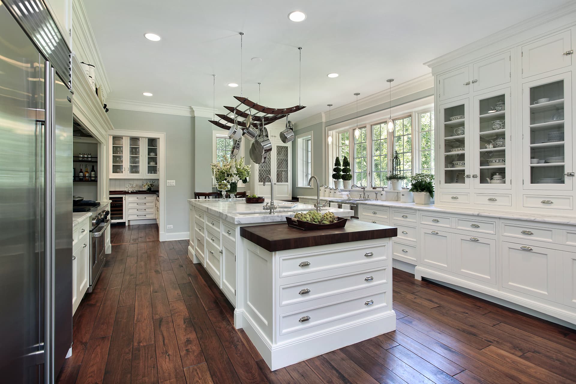 Custom kitchen remodel with white cabinetry, large island, and hardwood floors, Sioux Falls South Dakota