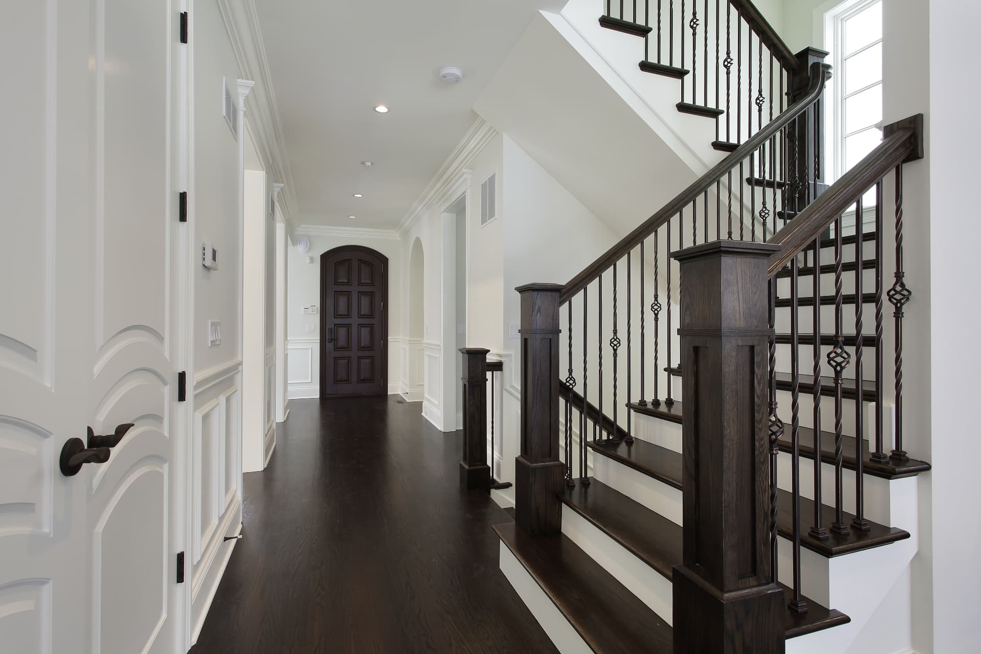 Custom door, hardwood flooring, and staircase railing millwork installation, Sioux Falls SD