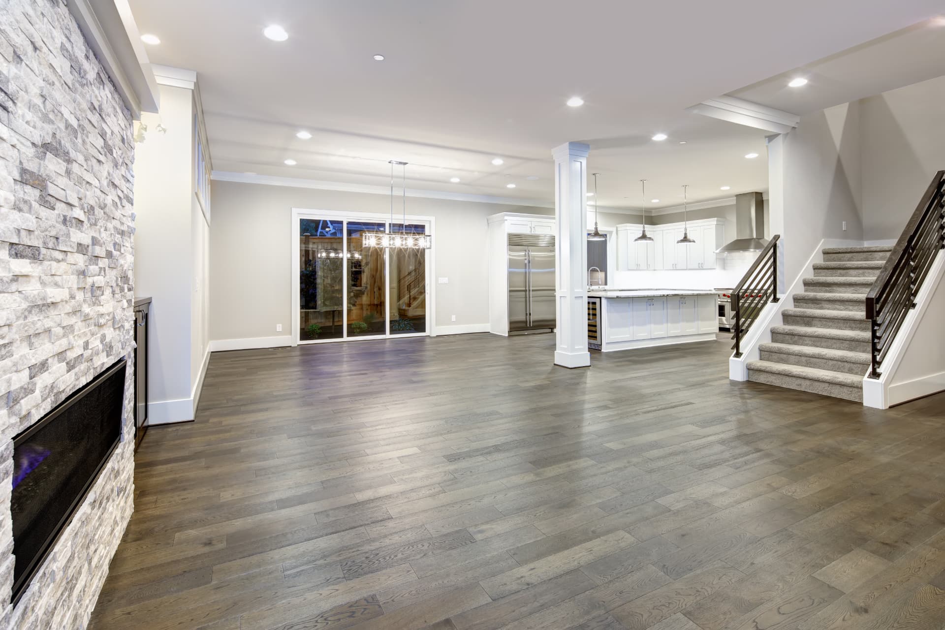 Basement finish work with open floor plan, kitchen, and staircase, Sioux Falls South Dakota